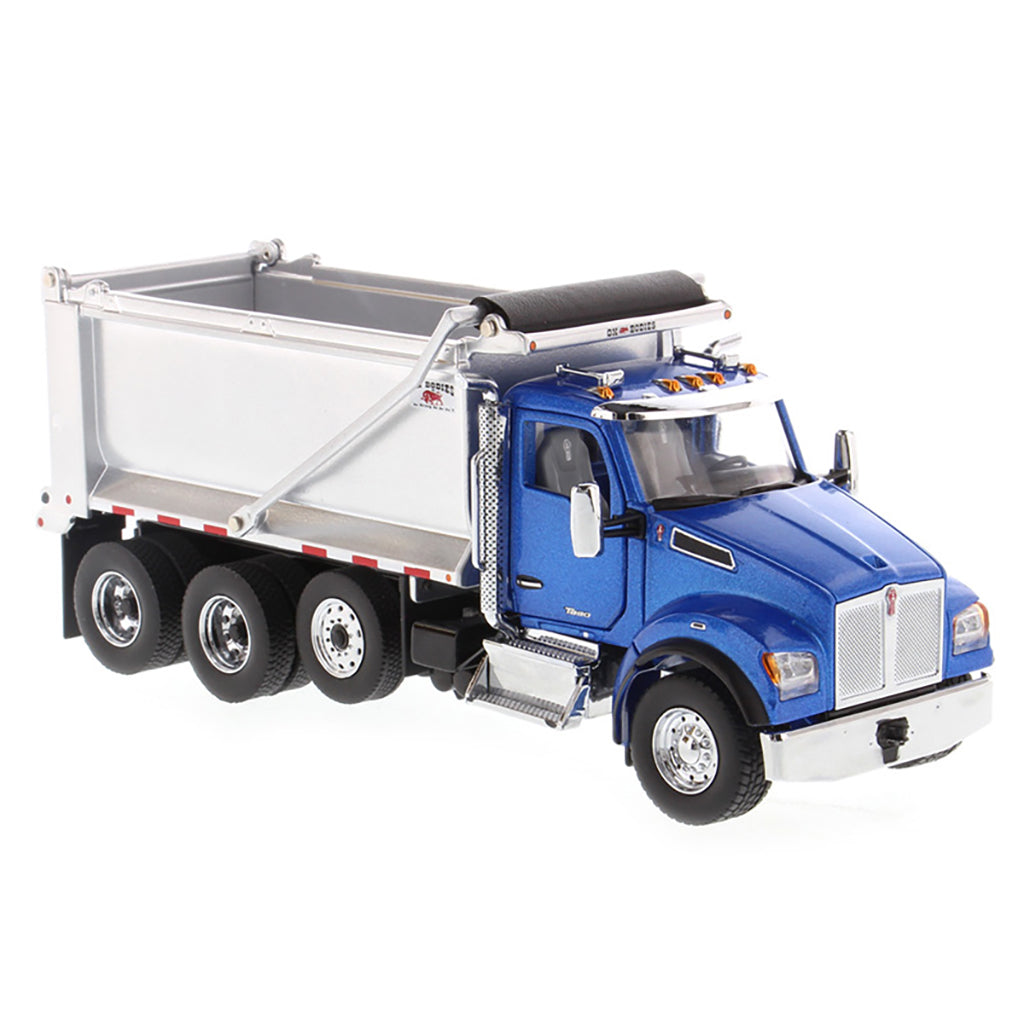 Model dump truck with blue cab and silver bed on a white background