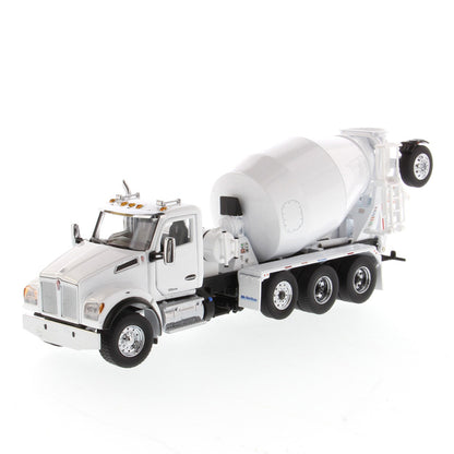 A white die-cast model of a Kenworth truck with a cement mixer drum, photographed on a seamless white background.