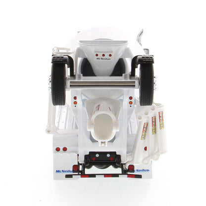 A white die-cast model of a Kenworth truck with a cement mixer drum, photographed on a seamless white background.