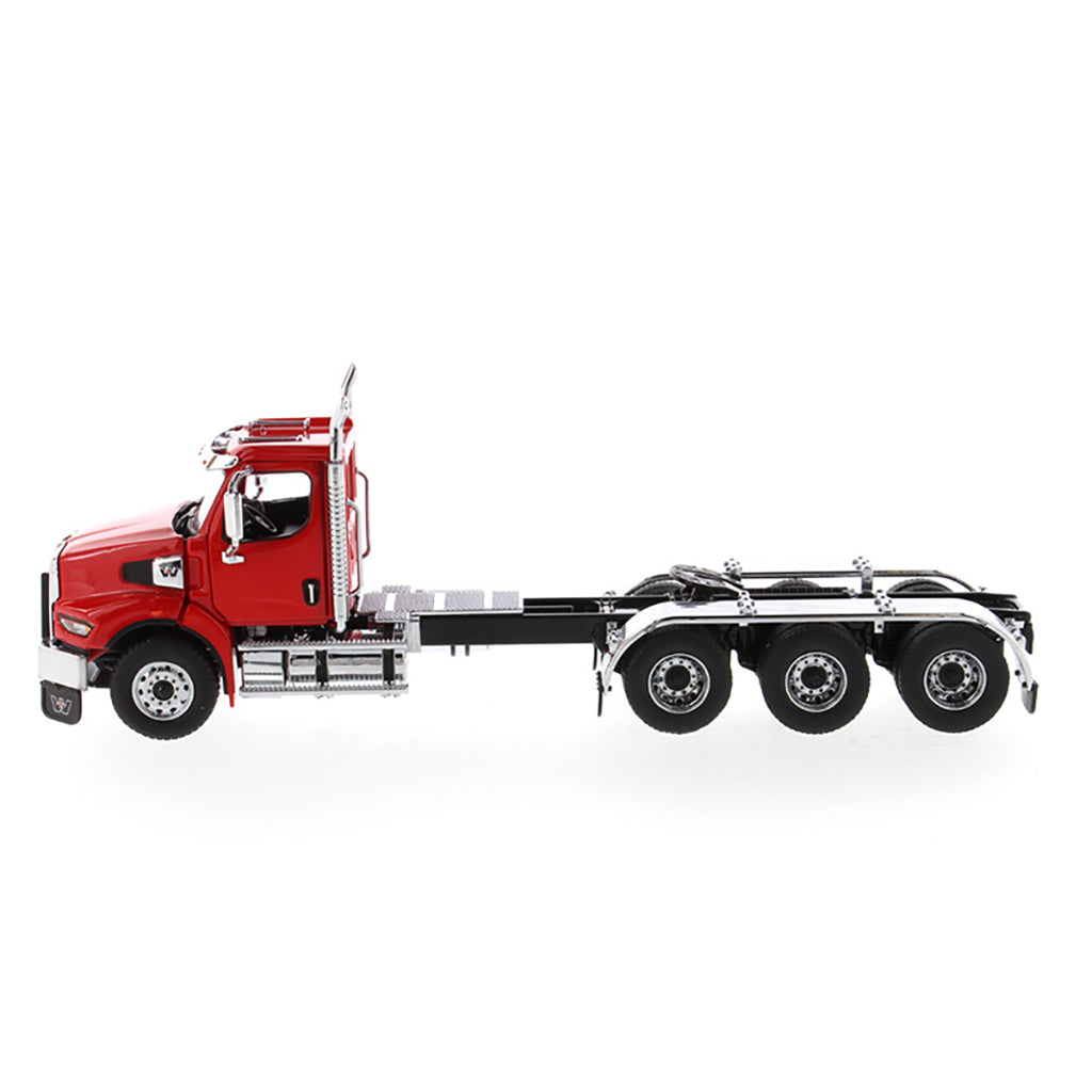 Model of a red Western Star 49X with Set-Back Front Axle and Tri-Drive on a White Background