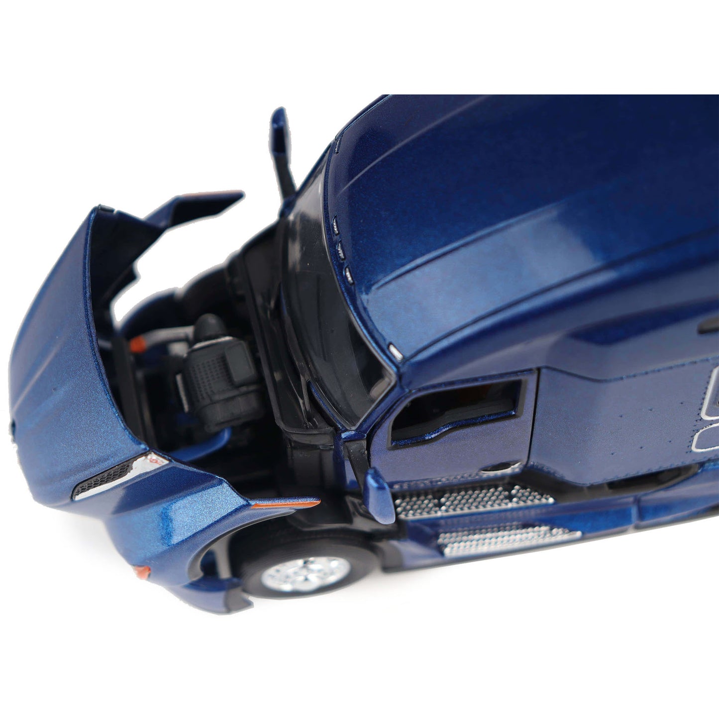 Close-up of a blue toy truck with open doors on a white background