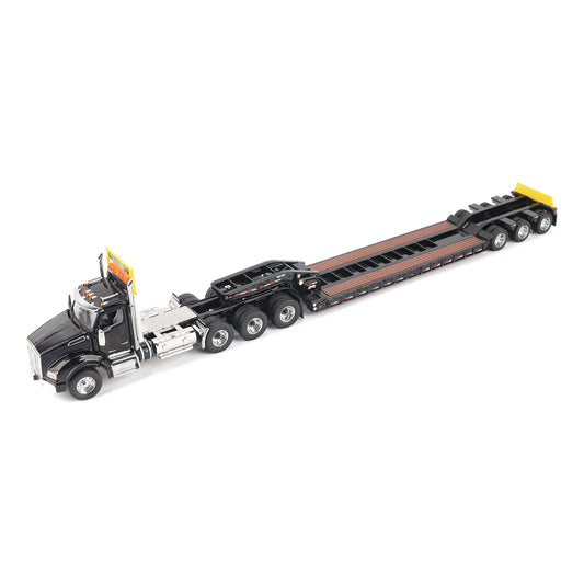 A detailed diecast model of a Kenworth T880 semi-truck towing a long black Trail King TK120 rgn lowboy trailer with a brown wood-look deck and yellow end caps, shown on a plain white background.