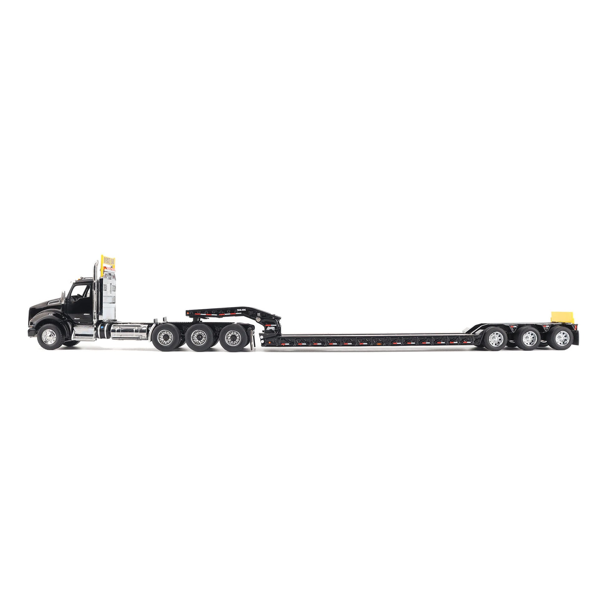 A detailed diecast model of a Kenworth T880 semi-truck towing a long black Trail King TK120 rgn lowboy trailer with a brown wood-look deck and yellow end caps, shown on a plain white background.