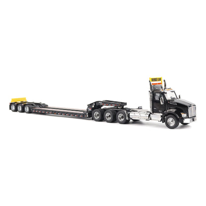 A detailed diecast model of a Kenworth T880 semi-truck towing a long black Trail King TK120 rgn lowboy trailer with a brown wood-look deck and yellow end caps, shown on a plain white background.