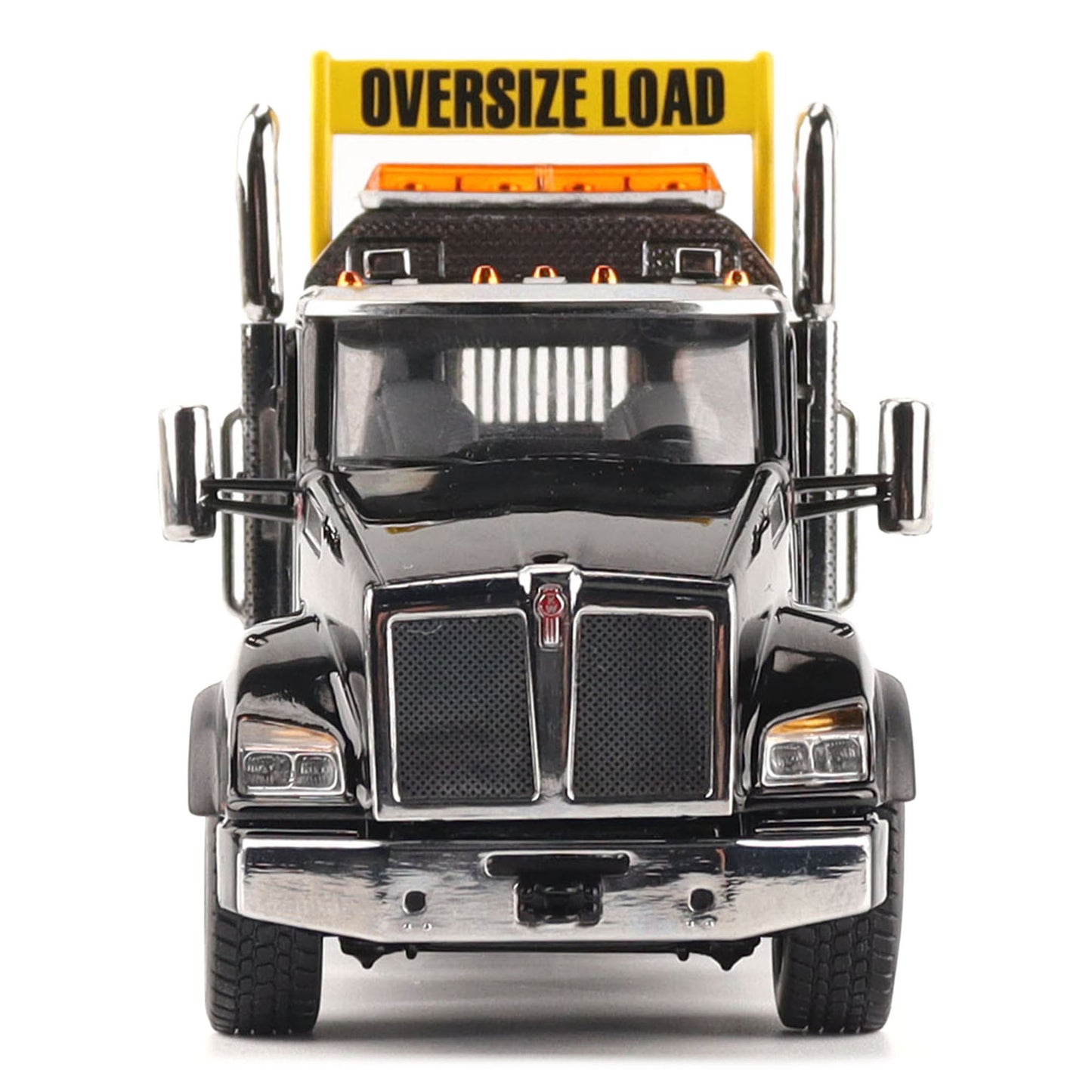 A detailed diecast model of a Kenworth T880 semi-truck towing a long black Trail King TK120 rgn lowboy trailer with a brown wood-look deck and yellow end caps, shown on a plain white background.