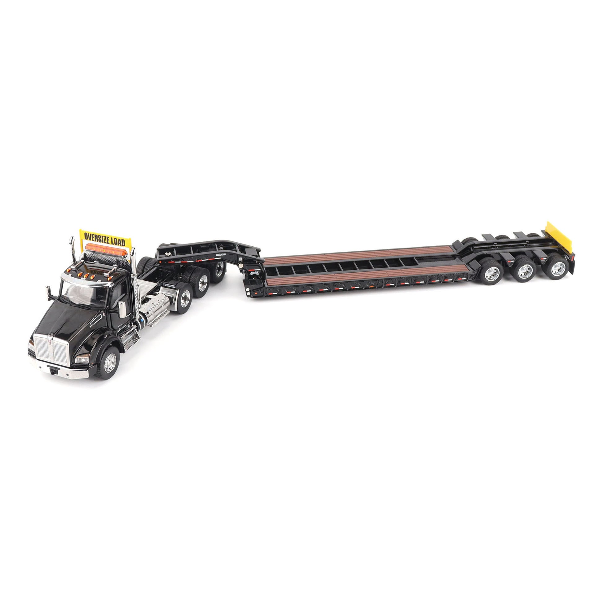 A detailed diecast model of a Kenworth T880 semi-truck towing a long black Trail King TK120 rgn lowboy trailer with a brown wood-look deck and yellow end caps, shown on a plain white background.