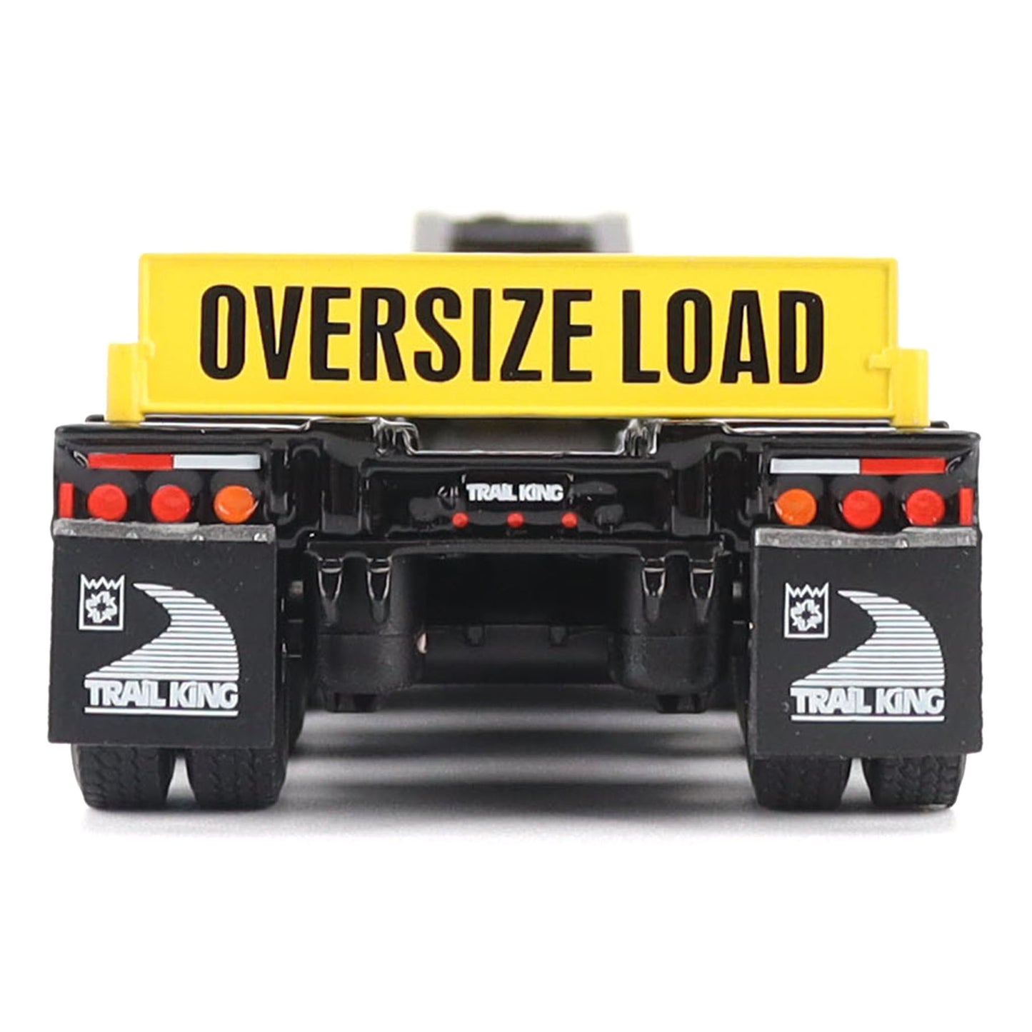A toy model of a Trail King oversize load trailer, shown from the rear. The trailer features a bright yellow cargo box with 'OVERSIZE LOAD' printed in black, a black chassis, and black mudguards with white Trail King logos.