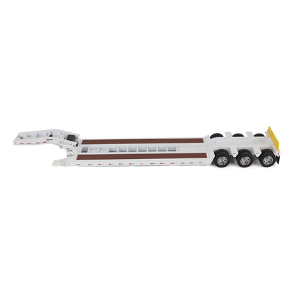 A miniature toy model of a Trail King TK120 lowboy trailer with a black frame, brown textured deck, and a yellow sign, shown on a solid white background.