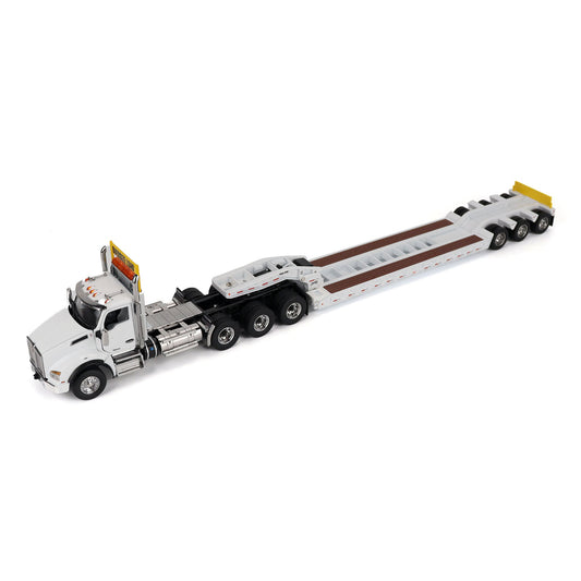 A detailed diecast model of a Kenworth T880 semi-truck towing a long black Trail King TK120 rgn lowboy trailer with a brown wood-look deck and yellow end caps, shown on a plain white background.