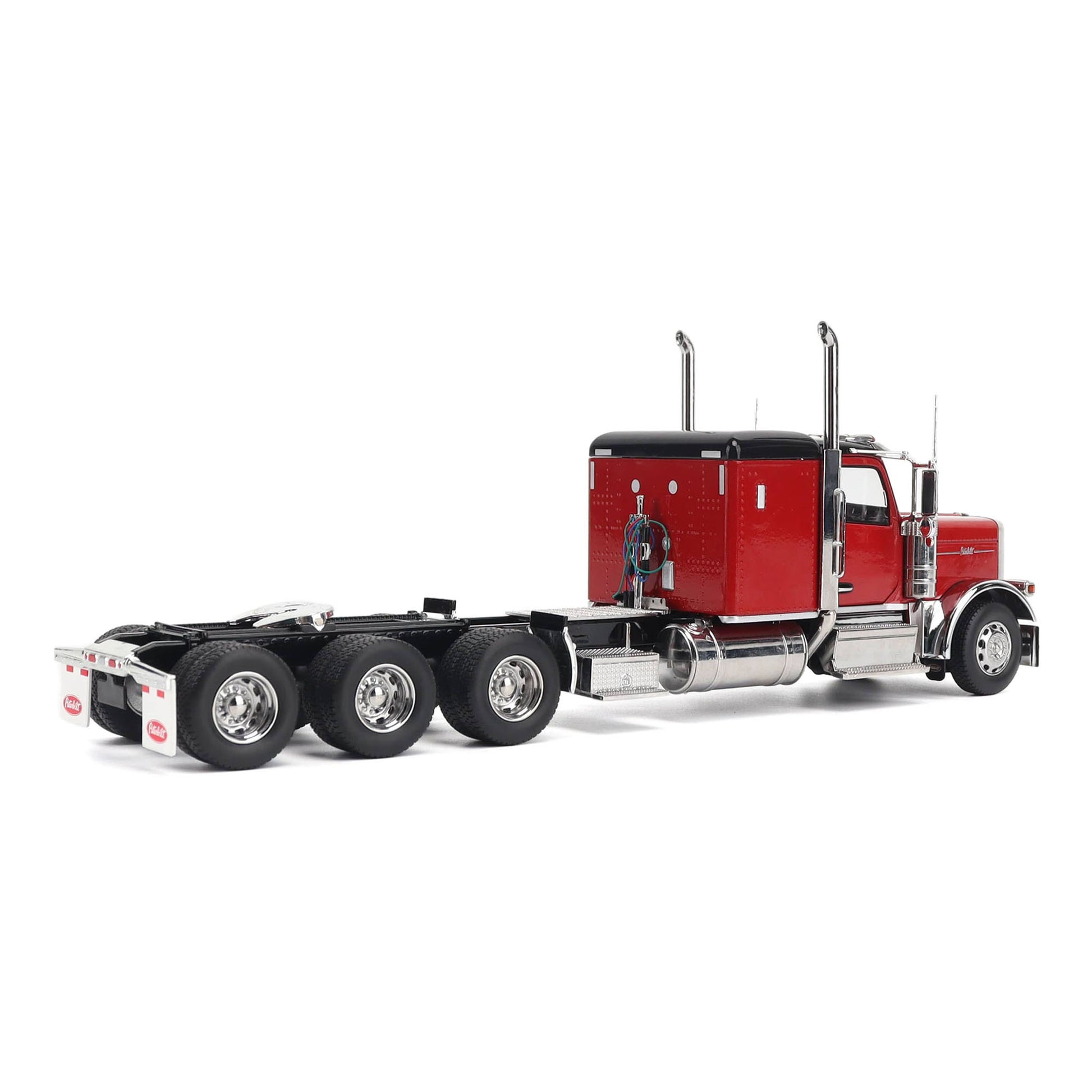 1:32nd Scale Diecast Model of a Peterbilt Model 589 in Legendary Red and Black Paint with Sleeper Compartment and Tri-Axle Configuration Photographed on a Clean White Background