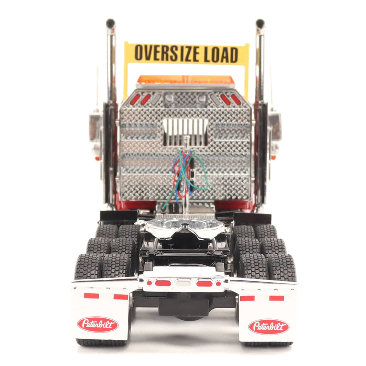 1:32nd Scale Diecast Model of a Peterbilt Model 589 Day Cab Tractor with Tri-Axle Configuration Photographed on a Clean White Background