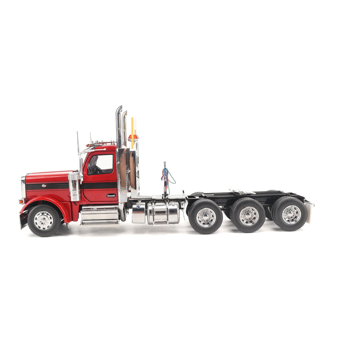 1:32nd Scale Diecast Model of a Peterbilt Model 589 Day Cab Tractor with Tri-Axle Configuration Photographed on a Clean White Background