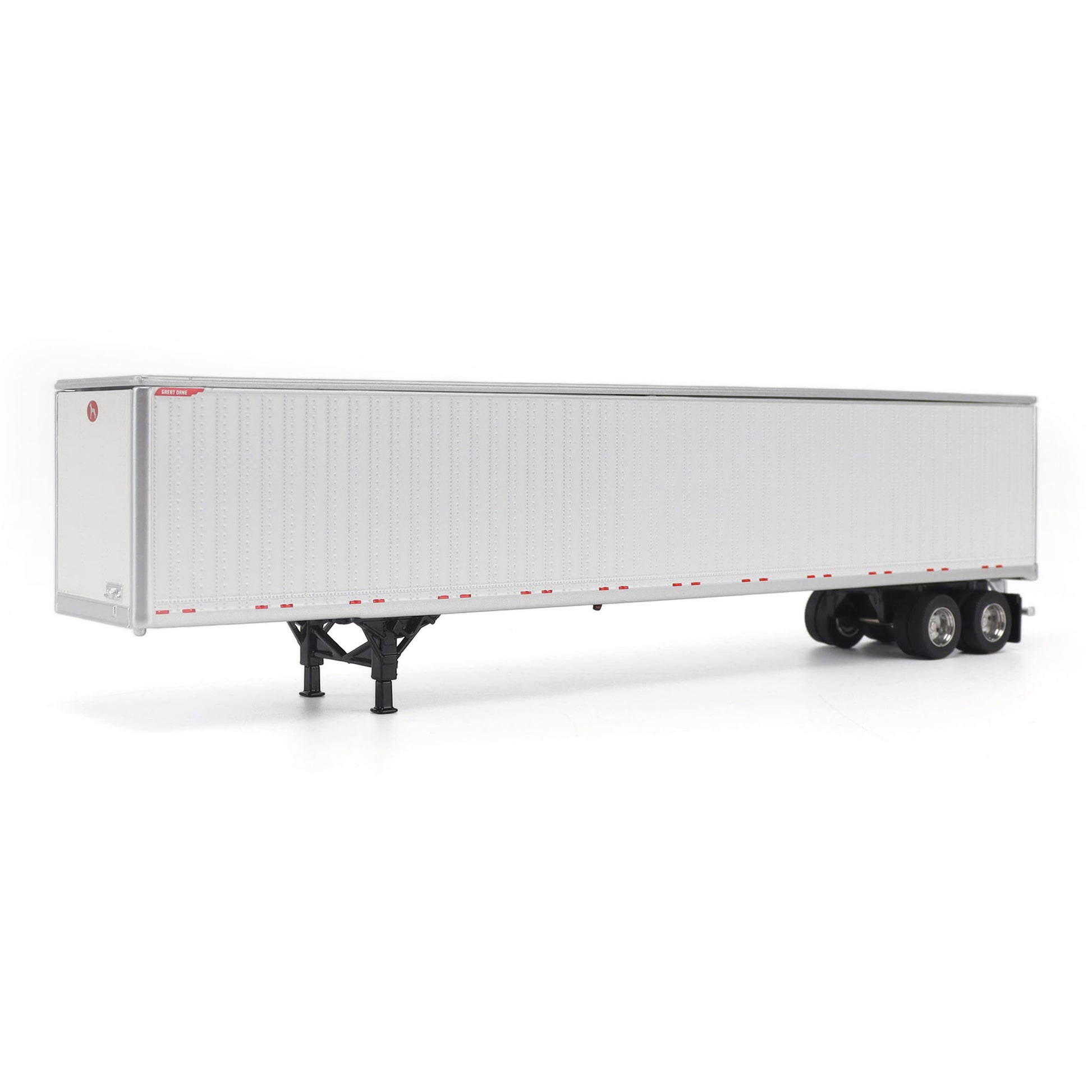 A long white Great Dane Champion semi-trailer shown in side view on a clean white studio background, with black wheels and support legs visible.