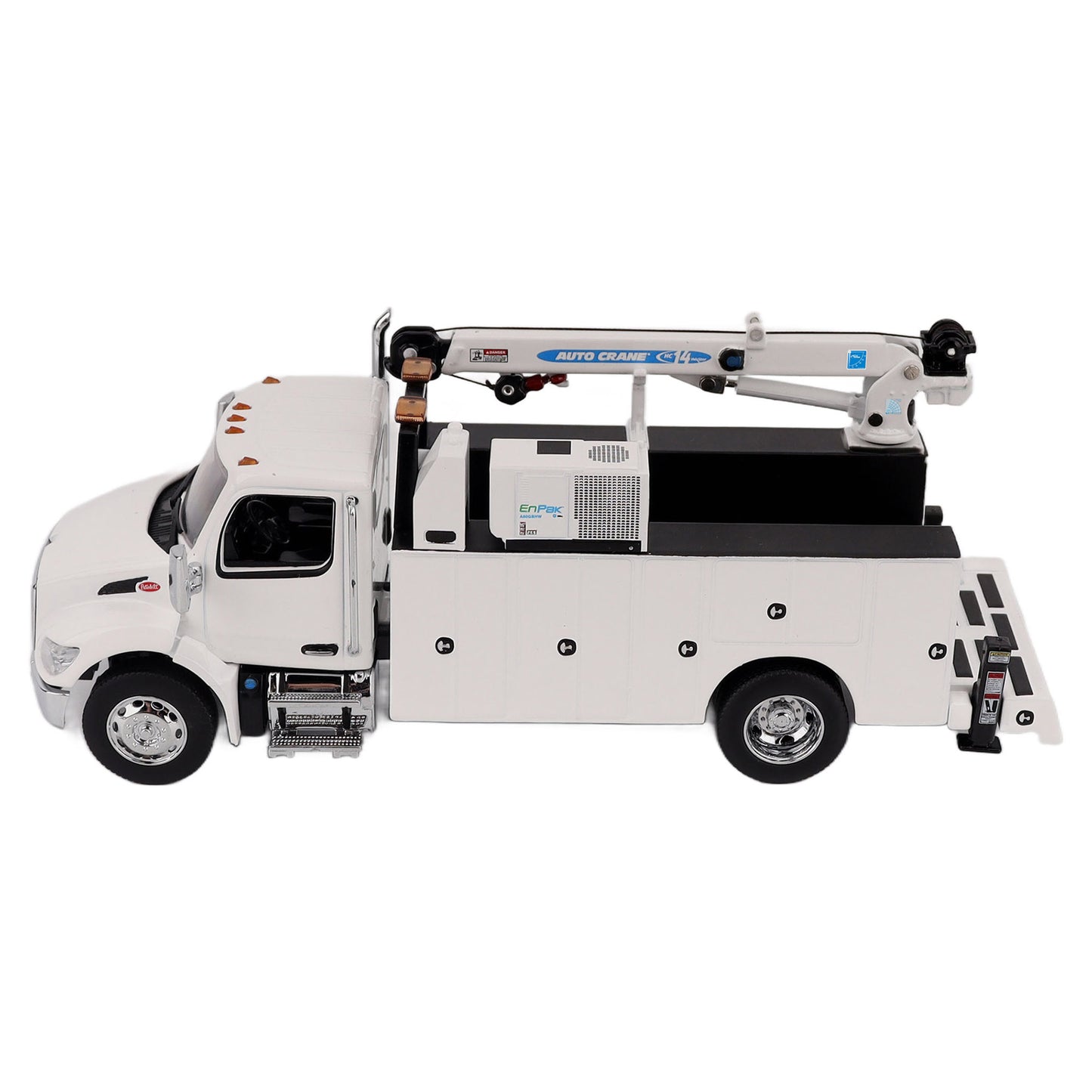 A White Diecast Model of a Peterbilt Model 536 Service Truck on a White Background