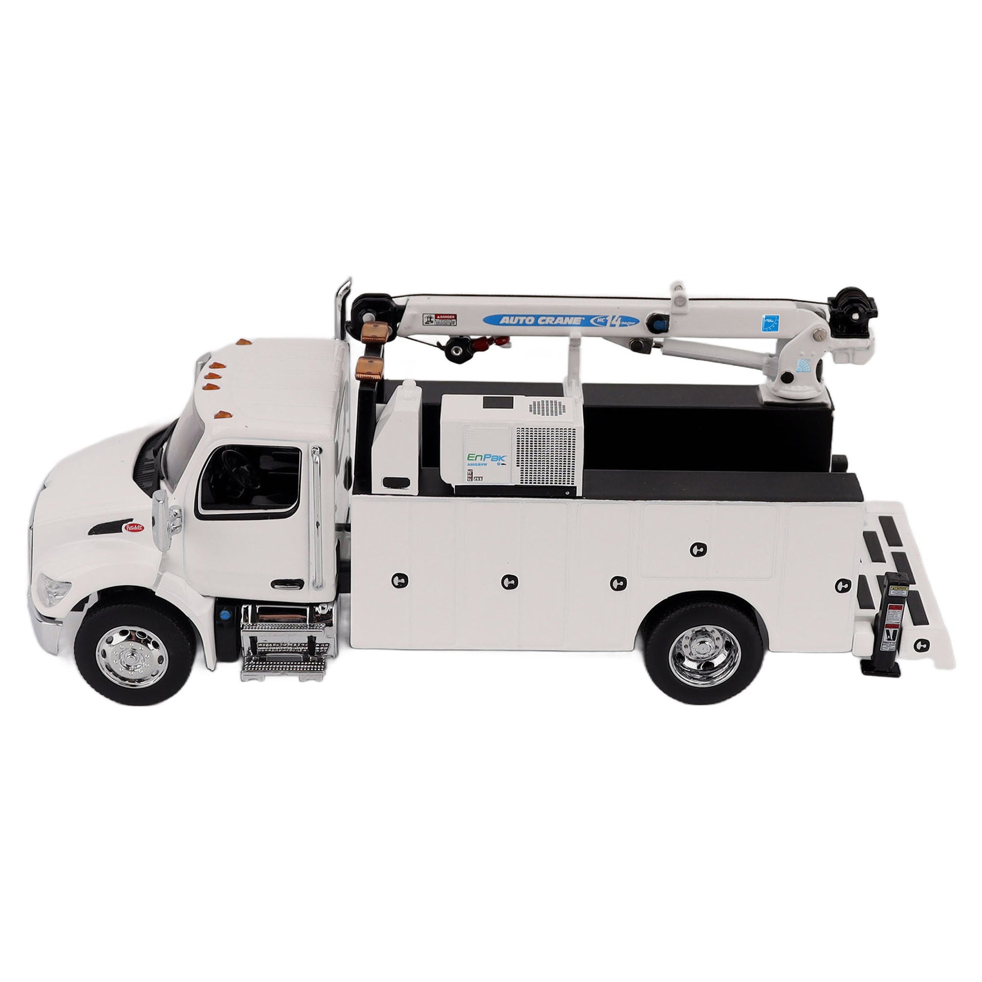 A White Diecast Model of a Peterbilt Model 536 Service Truck on a White Background