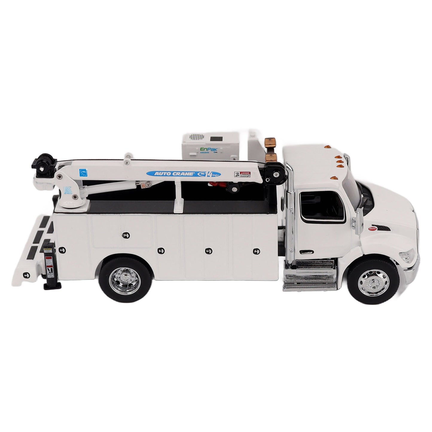 A White Diecast Model of a Peterbilt Model 536 Service Truck on a White Background