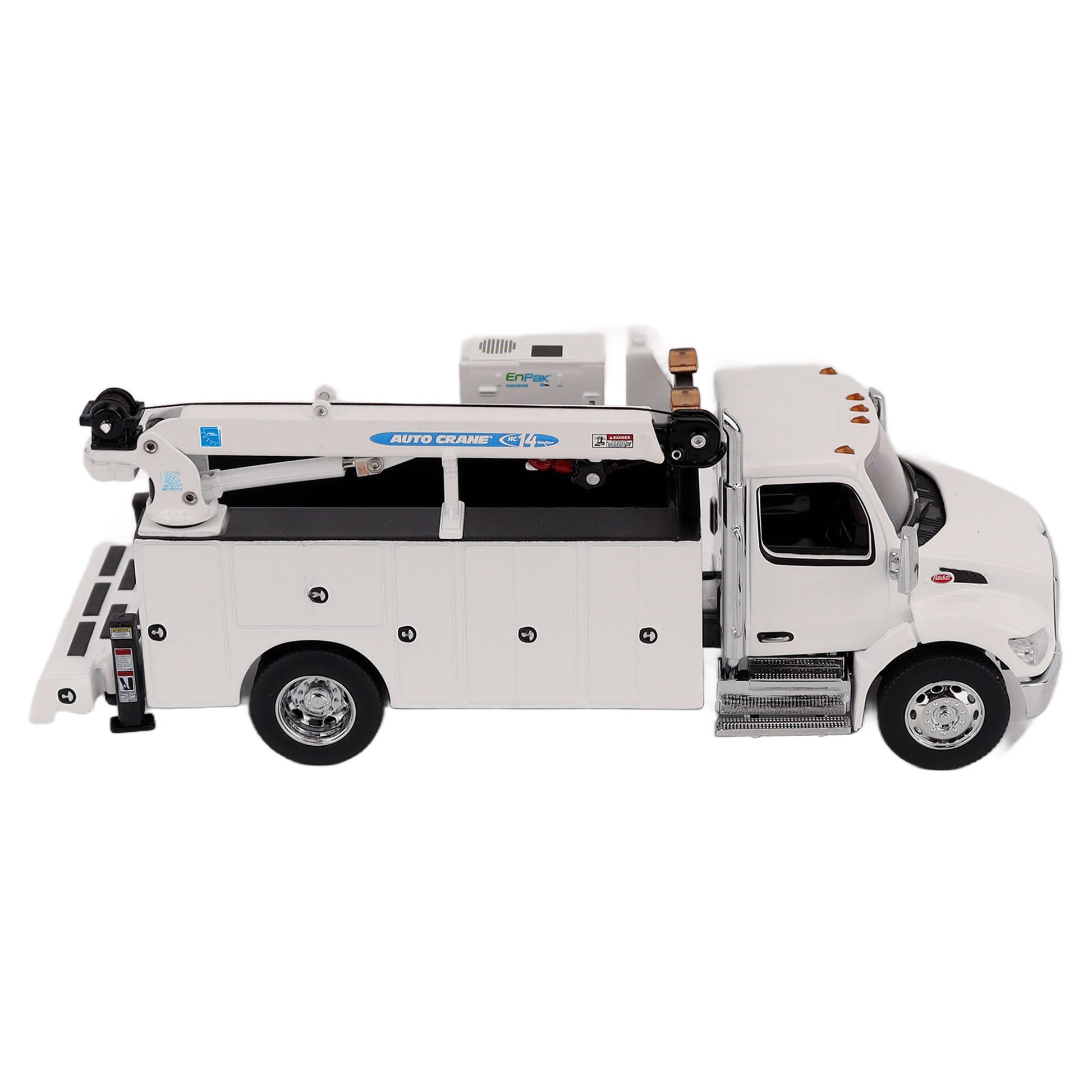 A White Diecast Model of a Peterbilt Model 536 Service Truck on a White Background