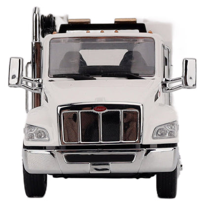 A White Diecast Model of a Peterbilt Model 536 Service Truck on a White Background