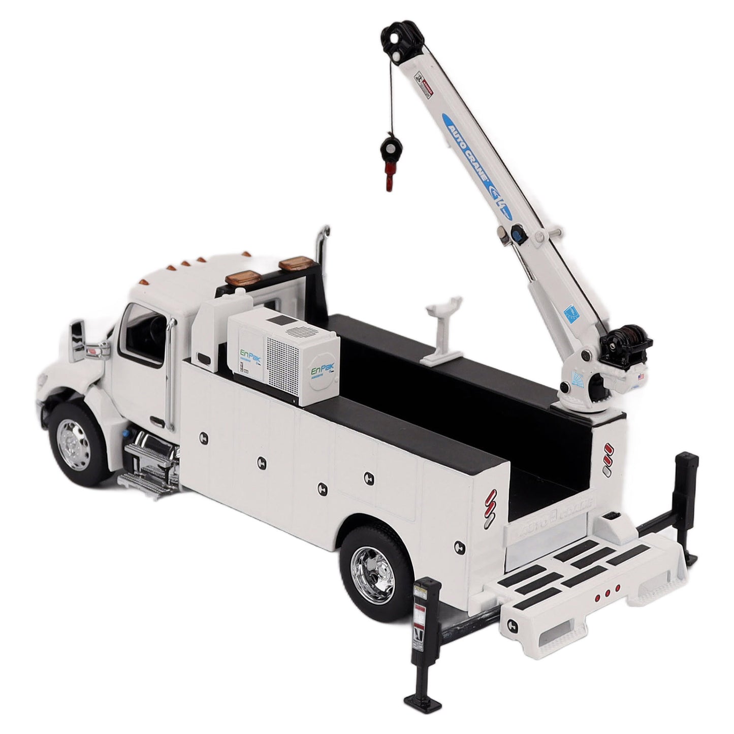 A White Diecast Model of a Peterbilt Model 536 Service Truck on a White Background