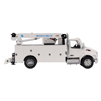 A White Diecast Model of a Peterbilt Model 536 Service Truck on a White Background