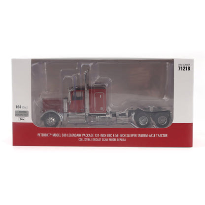Peterbilt 599 Legendary Package 131-inch 68-inch sleeper tandem-axle tractor die-cast model truck in its original retail packaging, featuring a red cab and silver chassis.