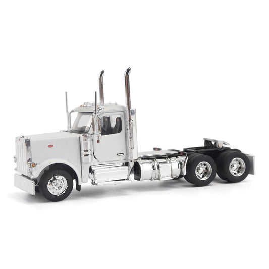 A detailed model of a classic white Peterbilt Model 589 day cab semi-truck cab with chrome exhausts, chrome wheels, and a black fuel tank and tires on a white background.