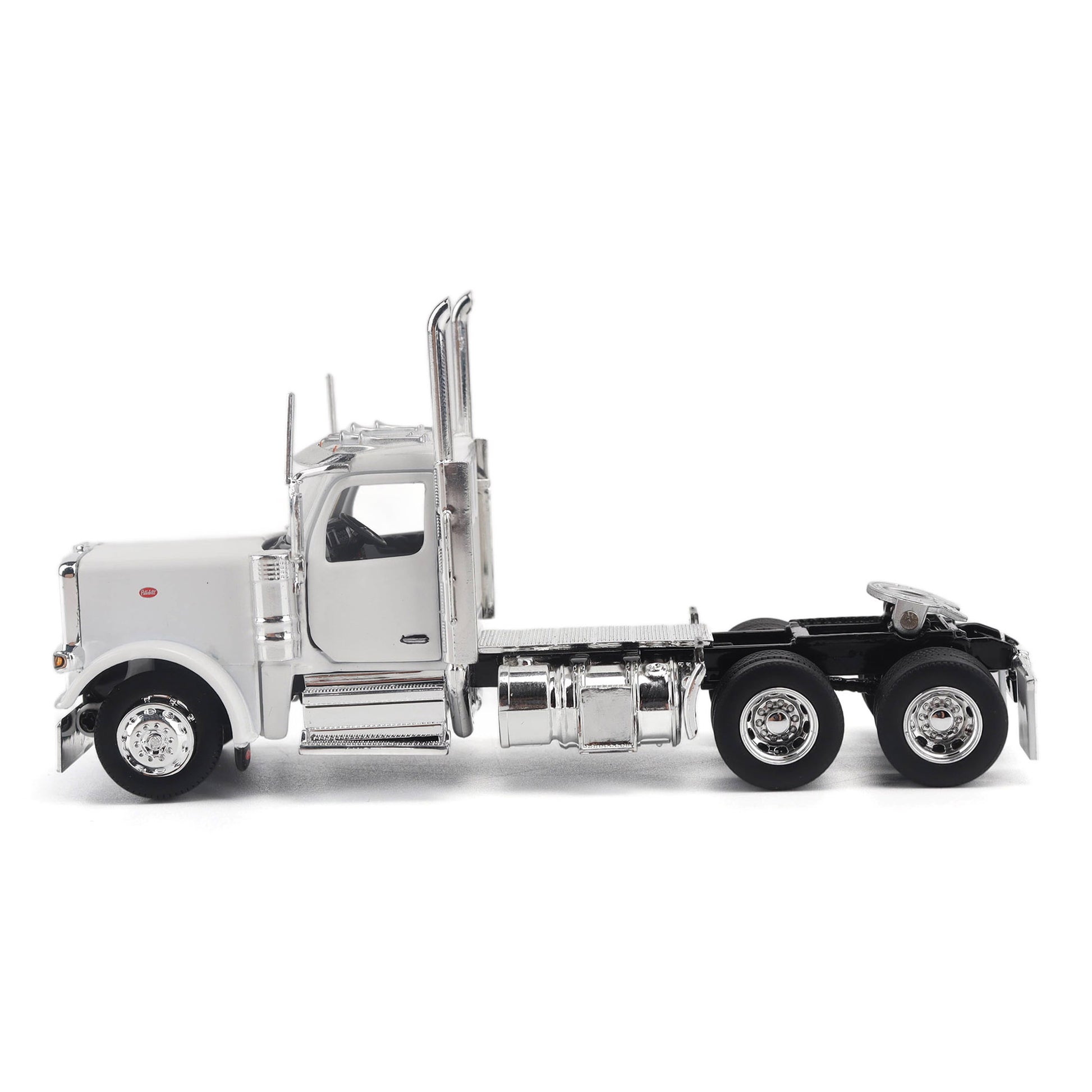 A detailed model of a classic white Peterbilt Model 589 day cab semi-truck cab with chrome exhausts, chrome wheels, and a black fuel tank and tires on a white background.