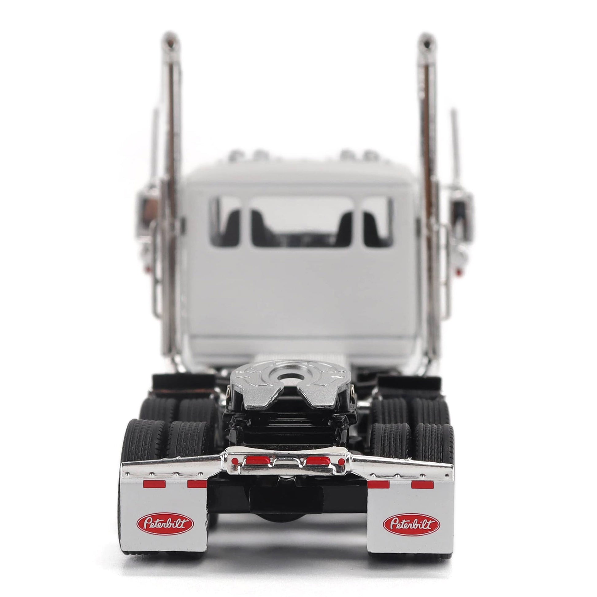 A detailed model of a classic white Peterbilt Model 589 day cab semi-truck cab with chrome exhausts, chrome wheels, and a black fuel tank and tires on a white background.