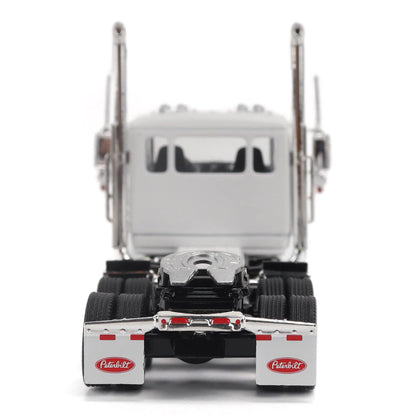 A detailed model of a classic white Peterbilt Model 589 day cab semi-truck cab with chrome exhausts, chrome wheels, and a black fuel tank and tires on a white background.