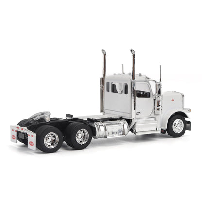 A detailed model of a classic white Peterbilt Model 589 day cab semi-truck cab with chrome exhausts, chrome wheels, and a black fuel tank and tires on a white background.