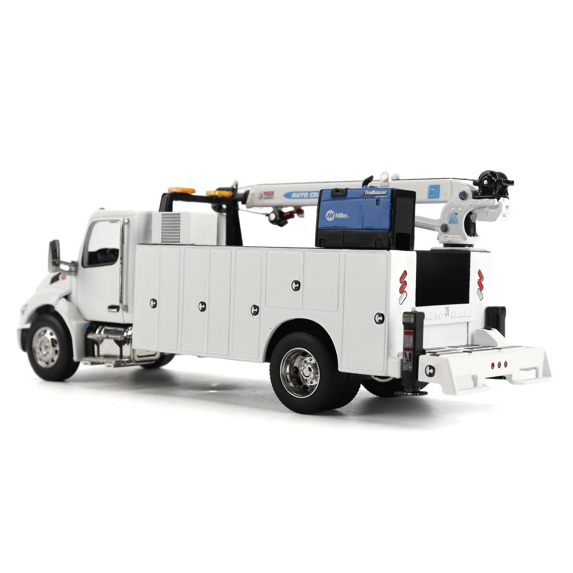 A White Diecast Model of a Peterbilt Model 536 Service Truck on a White Background