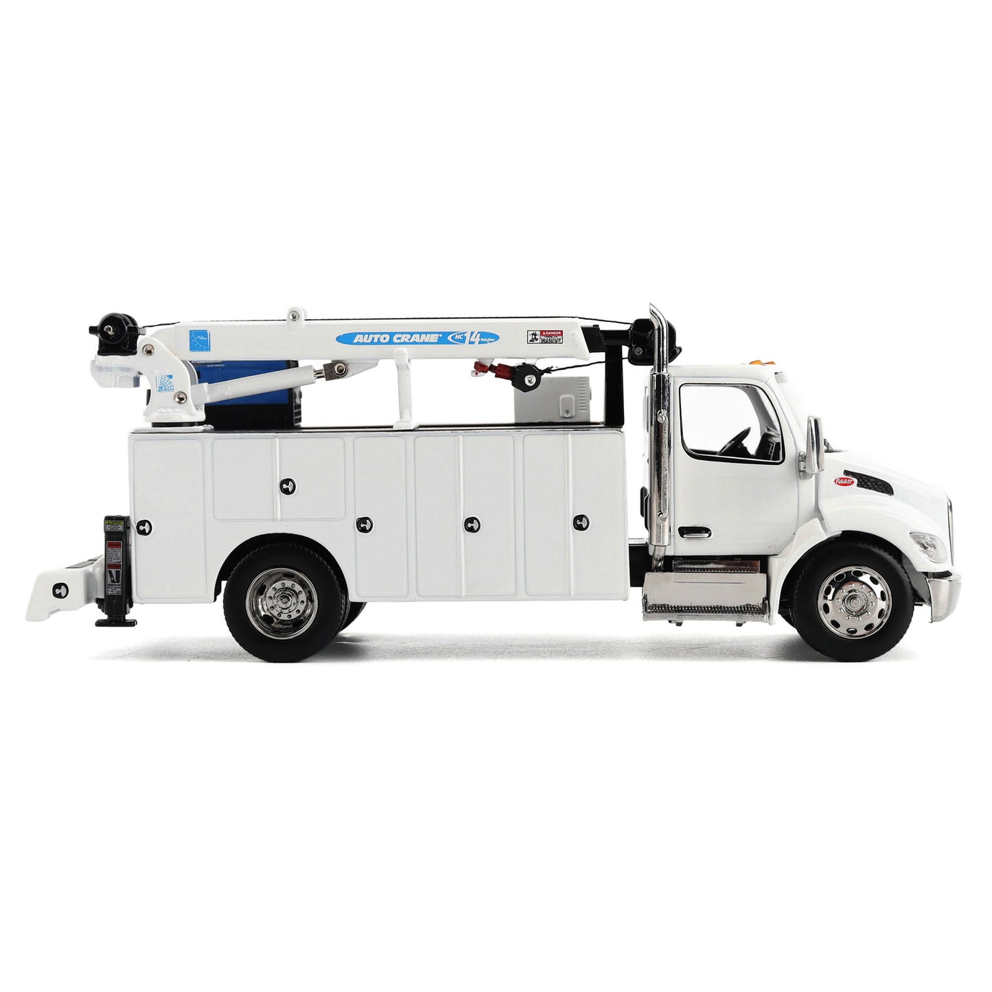 A White Diecast Model of a Peterbilt Model 536 Service Truck on a White Background