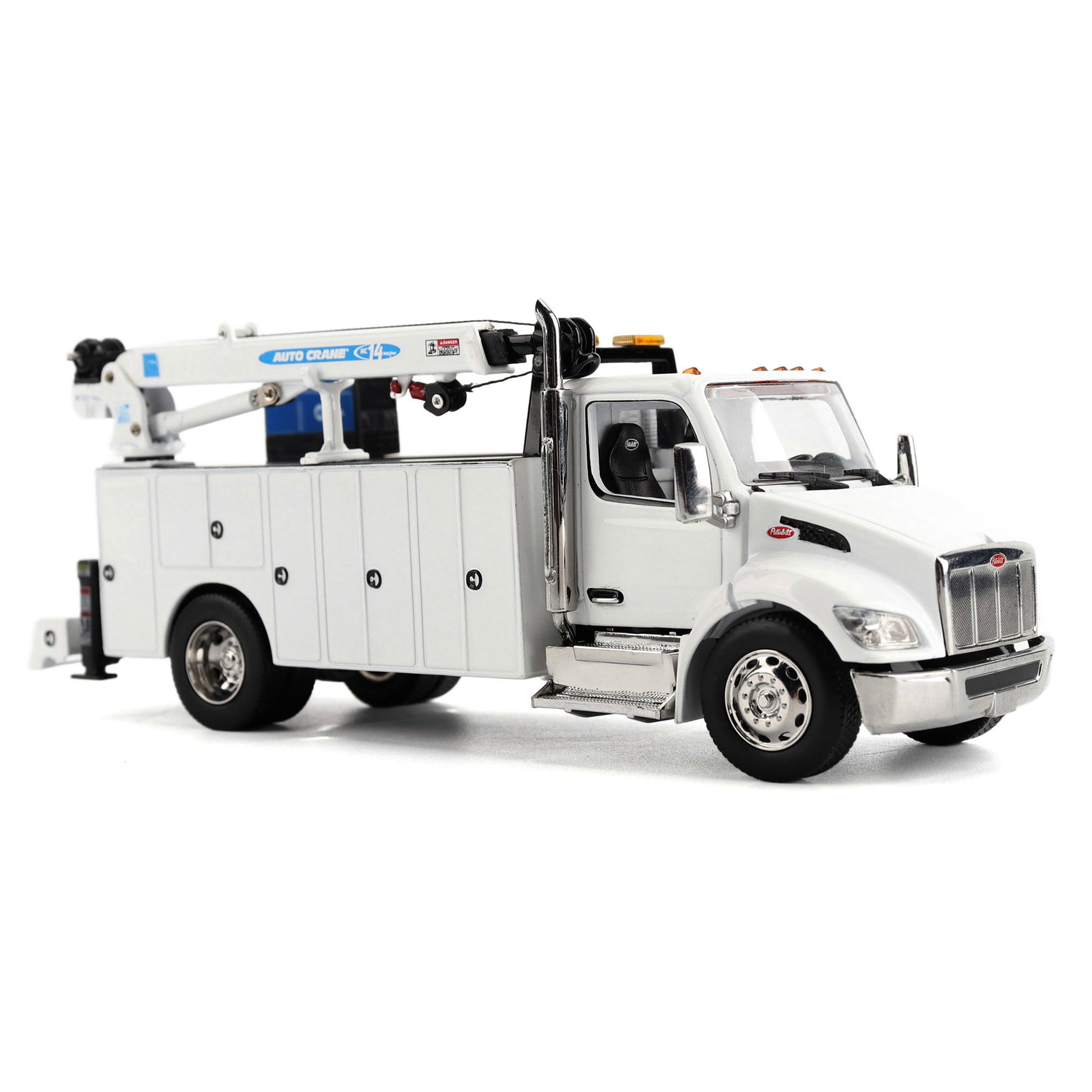 A White Diecast Model of a Peterbilt Model 536 Service Truck on a White Background