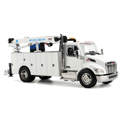 A White Diecast Model of a Peterbilt Model 536 Service Truck on a White Background