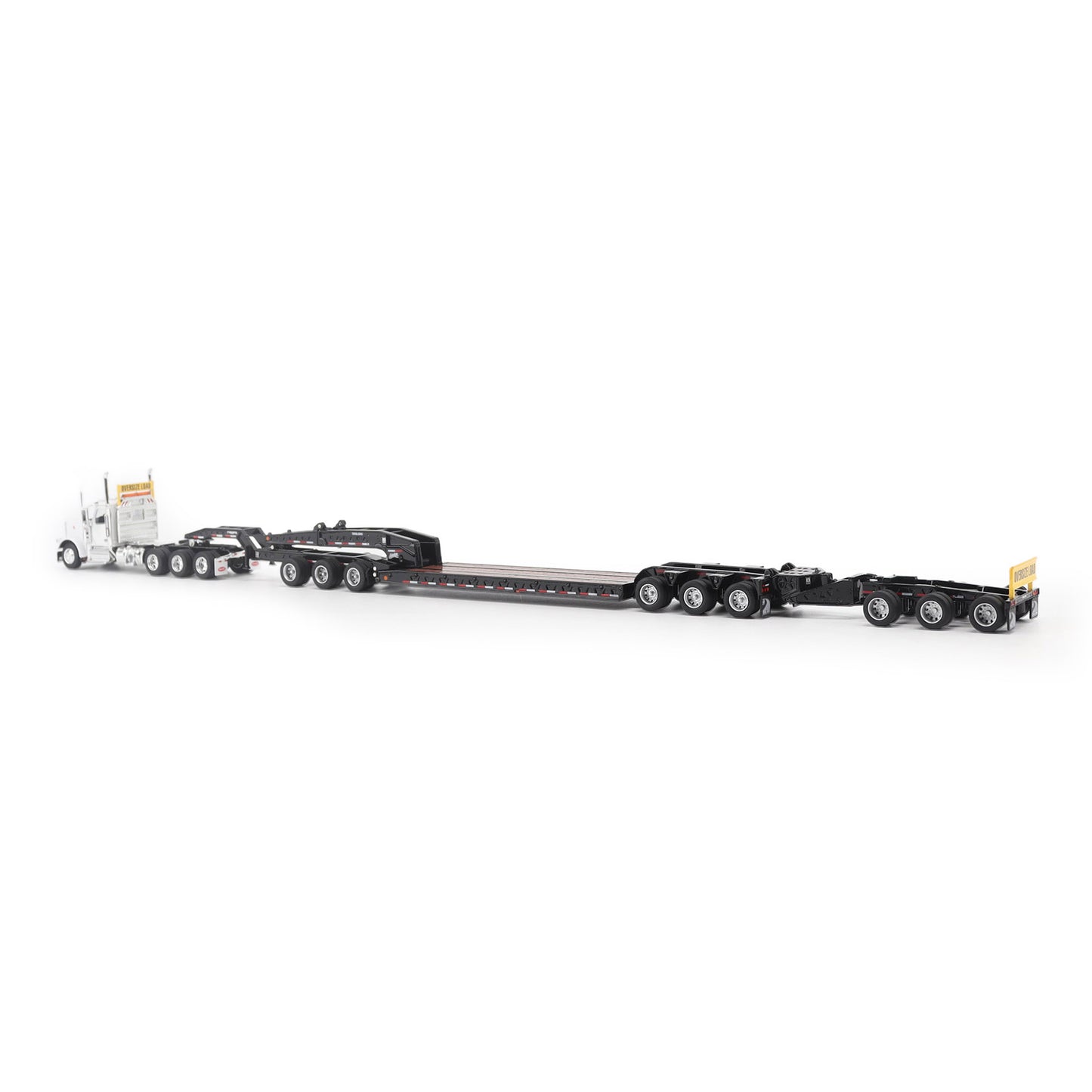 Model of a Peterbilt 589 Day Cab Pulling a Trail King TK170 RGN Trailer with Jeep and Stinger on a White Background