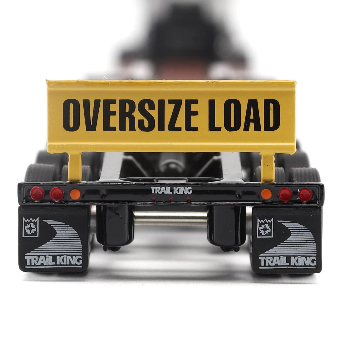 Model of a trailer with 'Oversize Load' sign and 'Trail King' branding on a white background