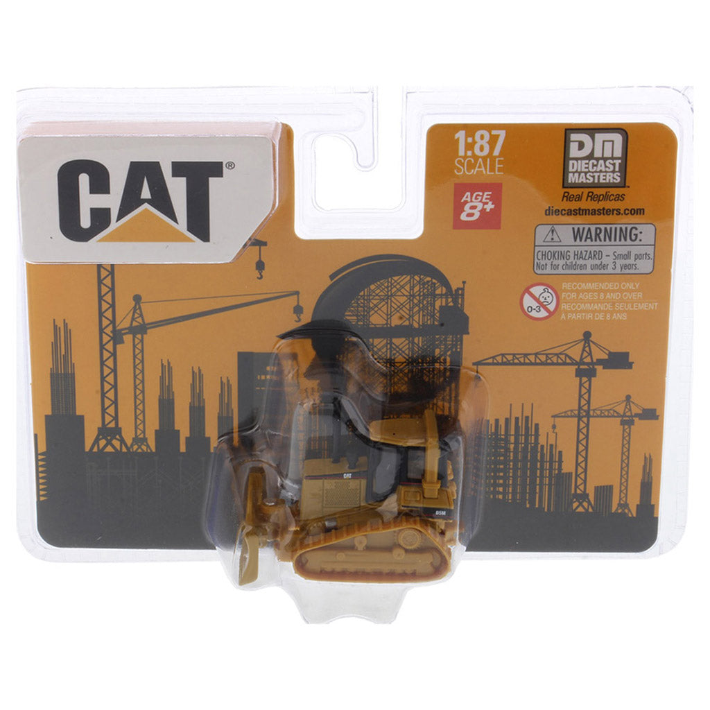 Model of a Caterpillar bulldozer in packaging with 'CAT' branding and construction-themed design.