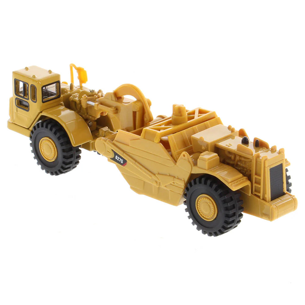 Model of a Caterpillar 627G Wheel Tractor Auger Scraper on a White Background