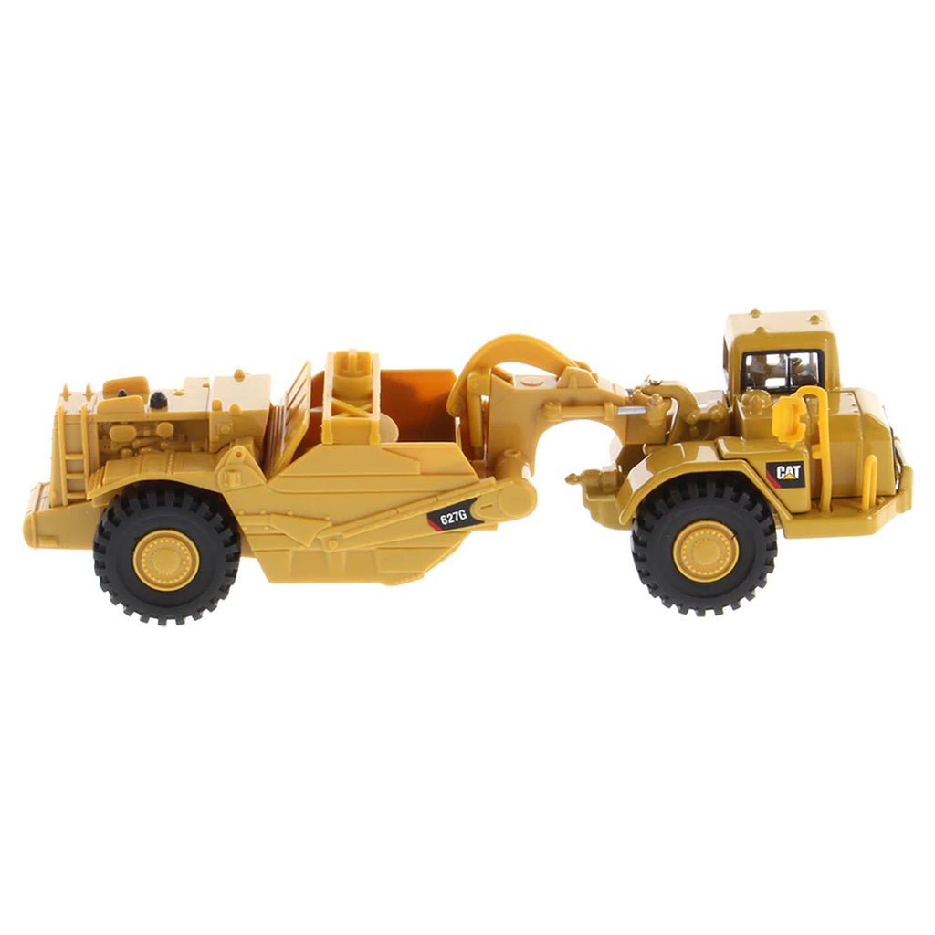 Model of a Caterpillar 627G Wheel Tractor Auger Scraper on a White Background