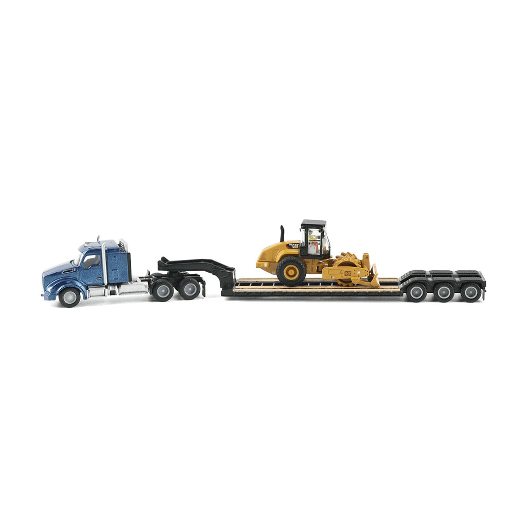Model of a blue Kenworth T880 hauling a XL Specialized Trailers XL120 Low-Profile HDG Lowboy Trailer with a CAT CP56 Padfoot Drum Vibratory Soil Compactor w/Enclosed Cab for a load on a white background