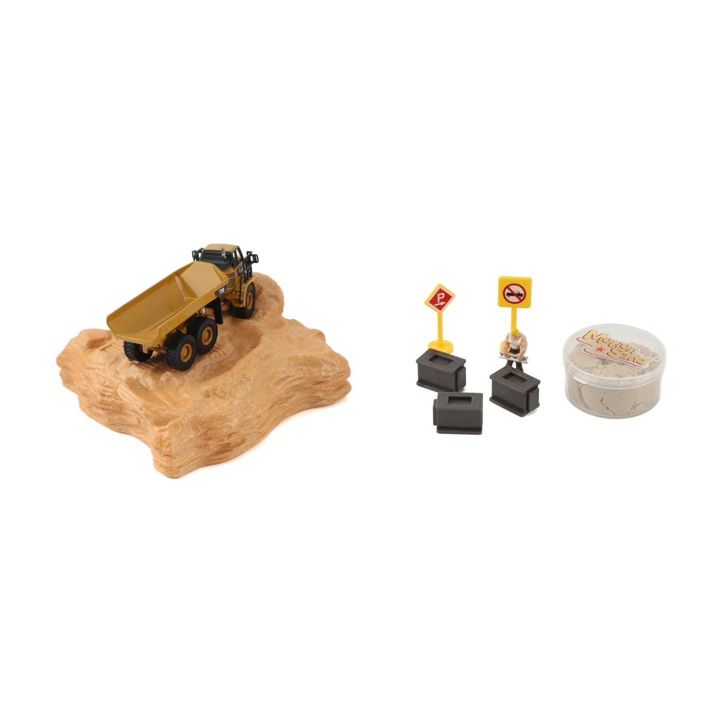 A miniature construction vehicle set on a white background, featuring a small yellow dump truck driving on a tan rocky base, along with small road signs, a miniature figure, and a round container of sand or modeling material.