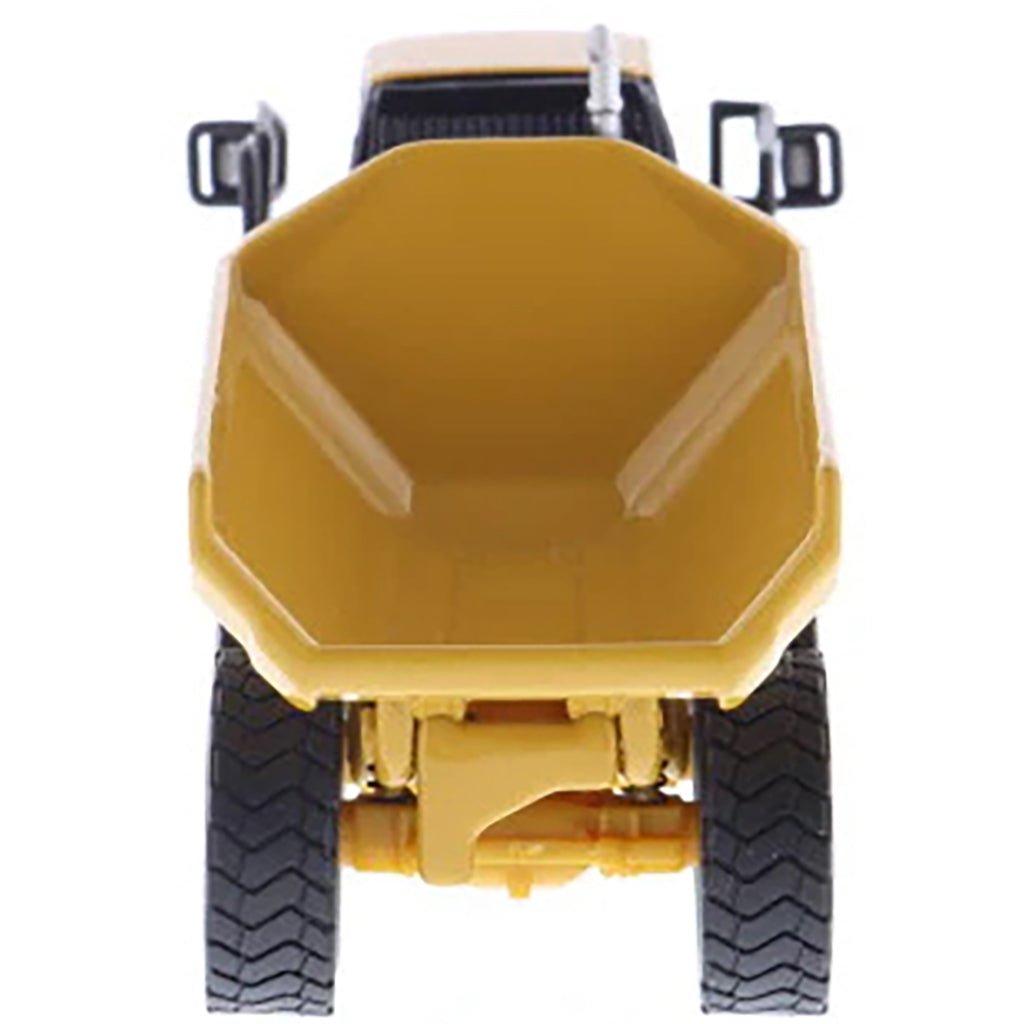 1:87 Scale Diecast and Plastic Model of a Yellow Caterpillar 730 Articulated Dump Truck on a White Background