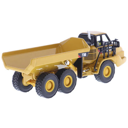 1:87 Scale Diecast and Plastic Model of a Yellow Caterpillar 730 Articulated Dump Truck on a White Background