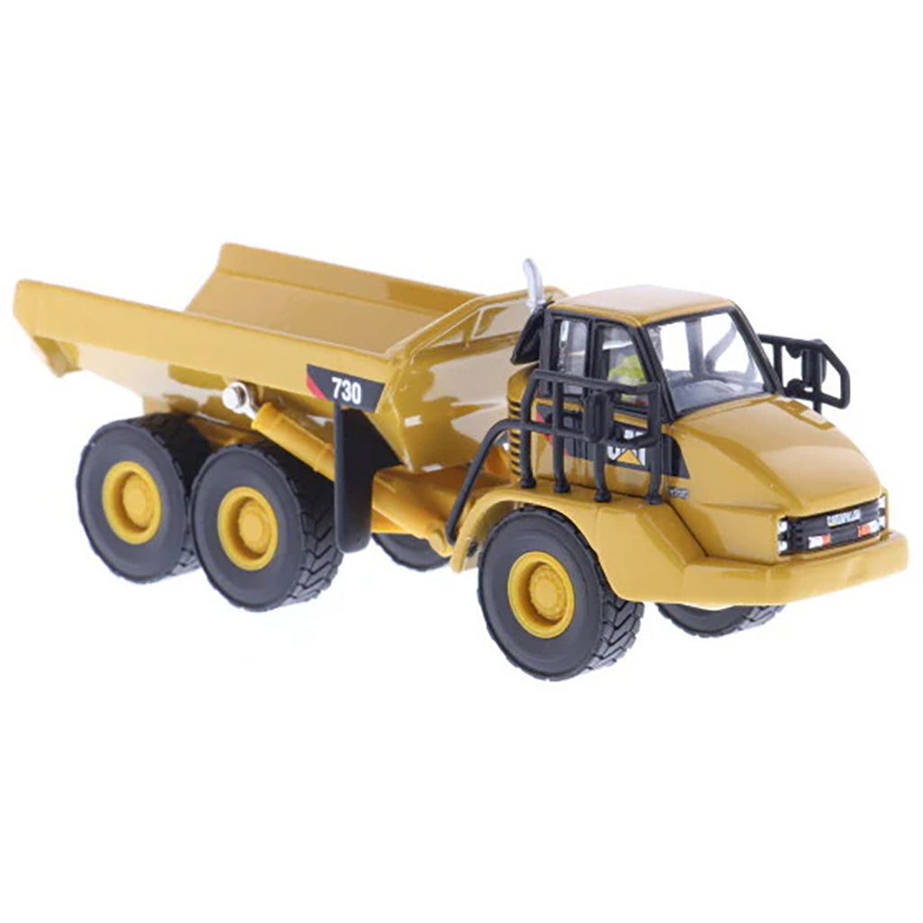 1:87 Scale Diecast and Plastic Model of a Yellow Caterpillar 730 Articulated Dump Truck on a White Background