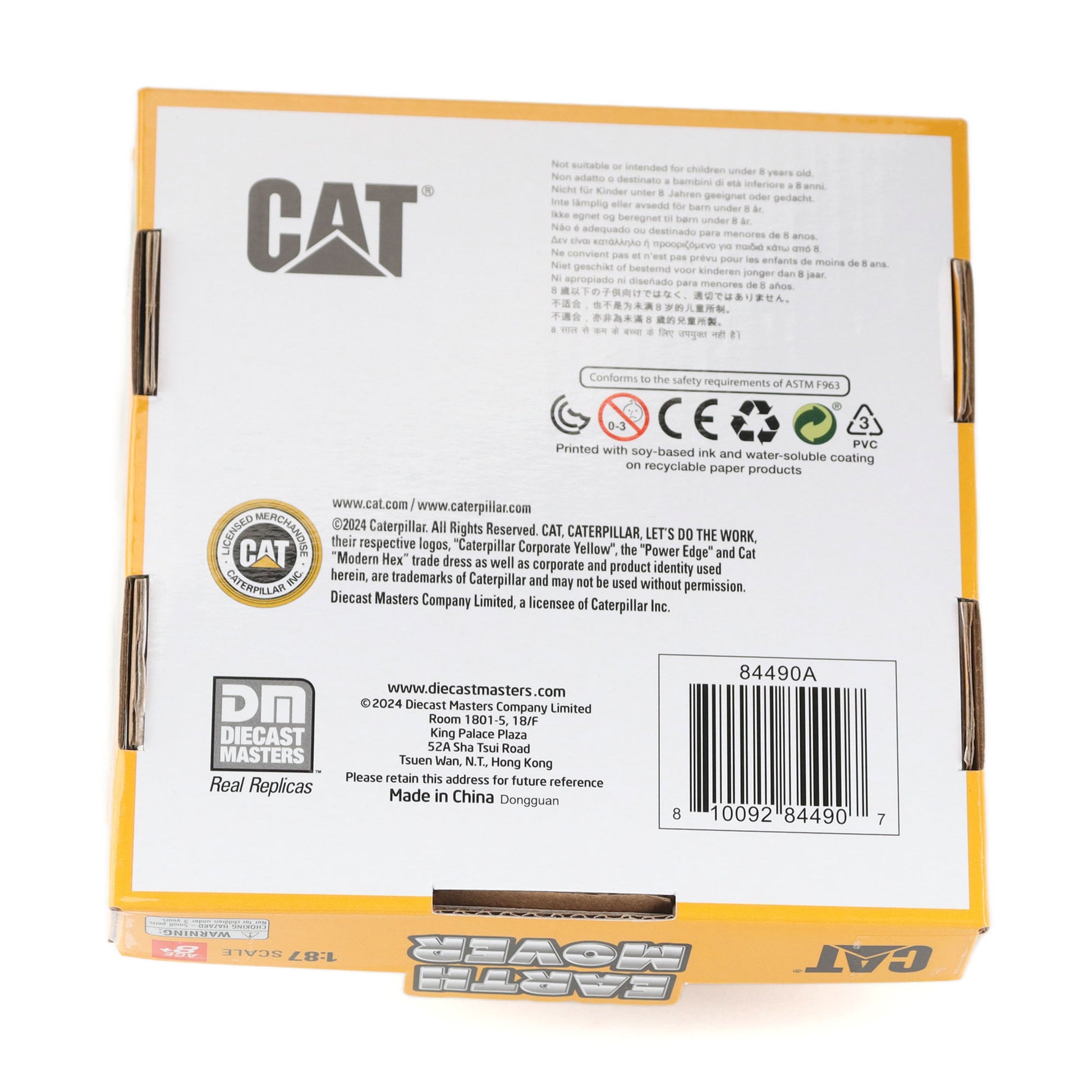 The back of a yellow and white CAT diecast model car box, featuring product specifications, safety icons, a barcode, and the CAT and Decast Masters logos.