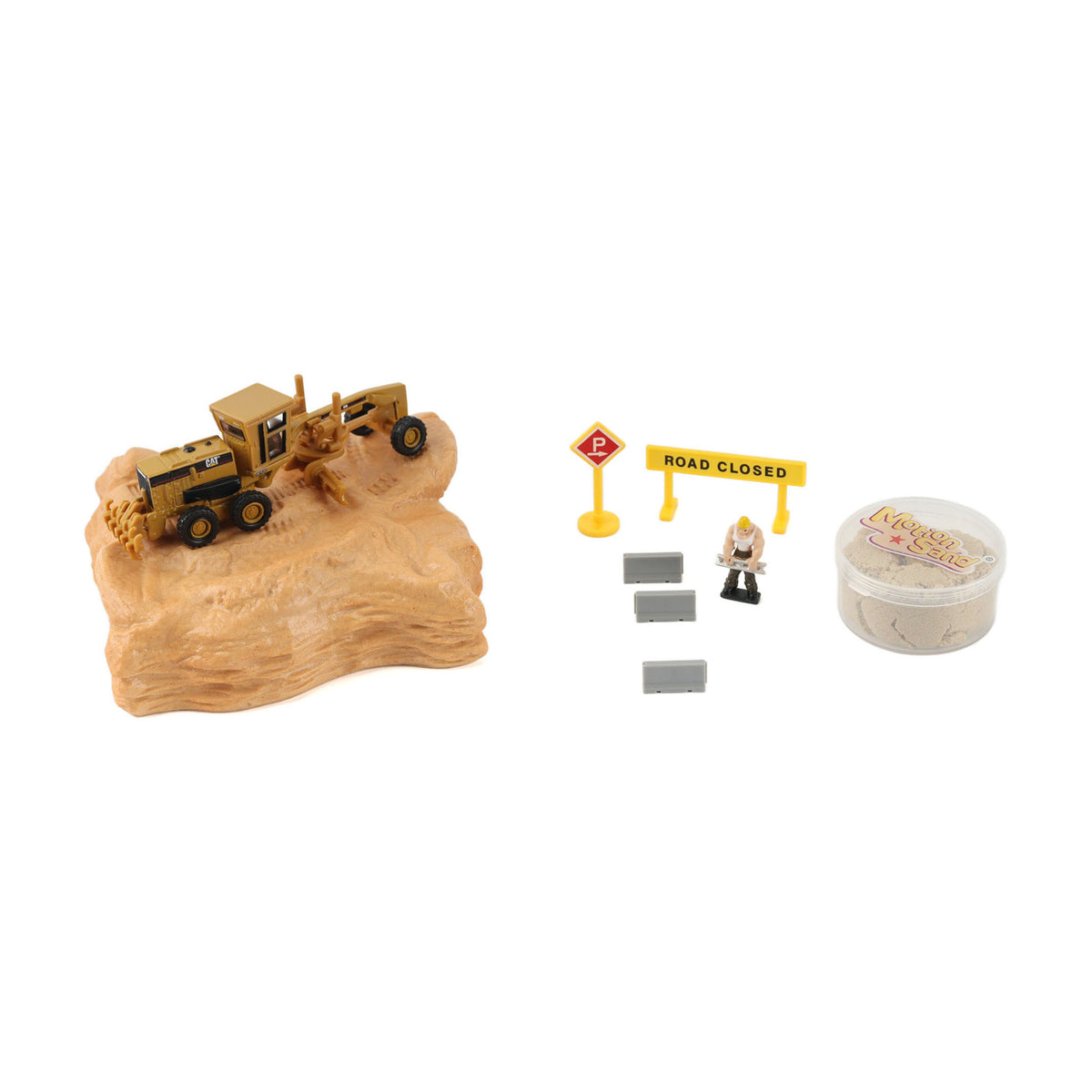 A miniature construction-themed toy set on a white background, featuring a yellow construction vehicle on a tan rocky base, a yellow road closed sign, small gray blocks, a tiny figure, and a round container of sand.