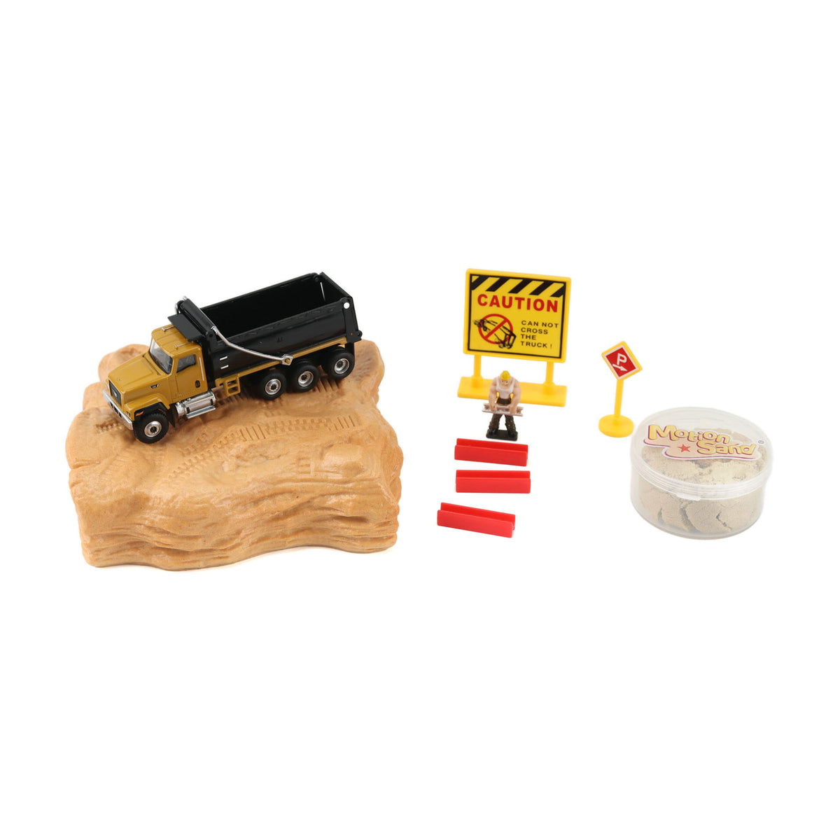 Toy dump truck on a rock with construction accessories on a white background