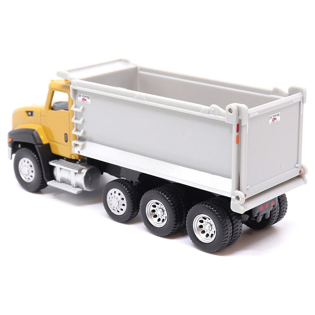 Toy CAT dump truck with yellow cab and gray bed on a white background