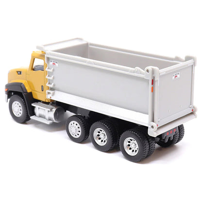 Toy CAT dump truck with yellow cab and gray bed on a white background