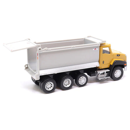 Toy CAT dump truck with yellow cab and gray bed on a white background